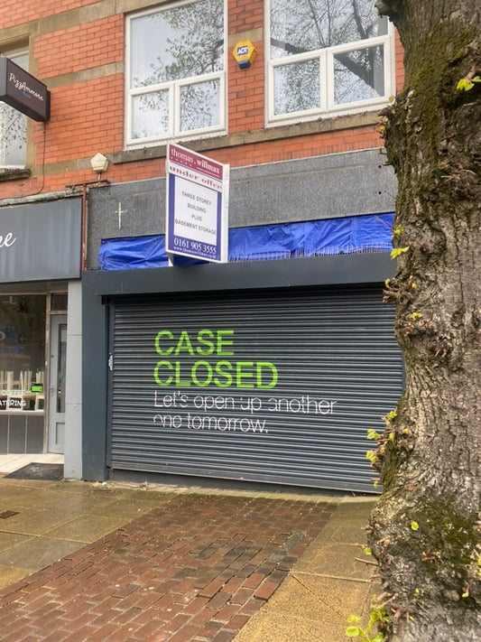 Shopfront with 'under offer' sign and shutter closed. The new premises of Shine - 18 School Road